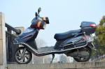 Partenariat entre le VTC Grab et le constructeur Kymco